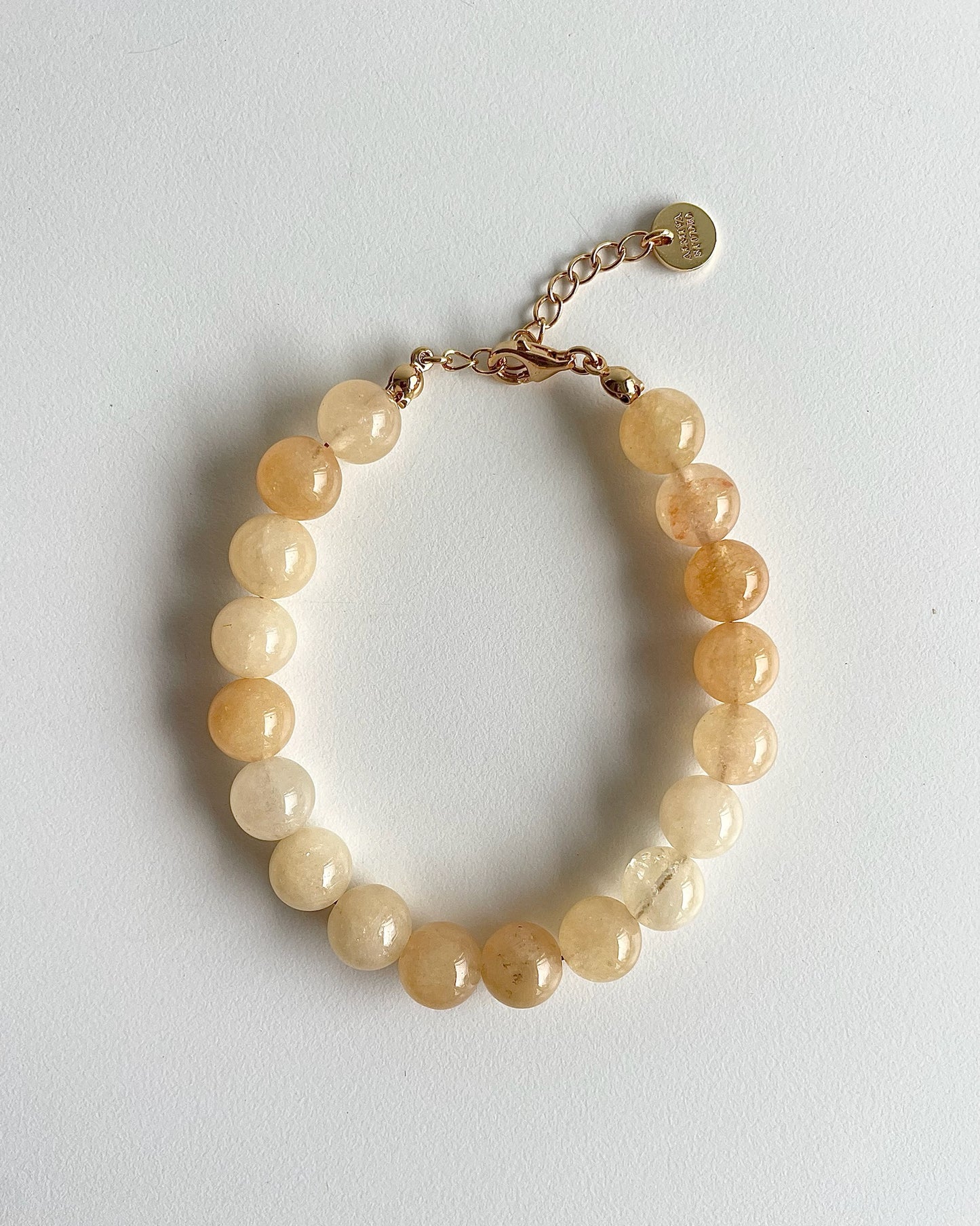 Bredt perle armbånd i gule nuancer